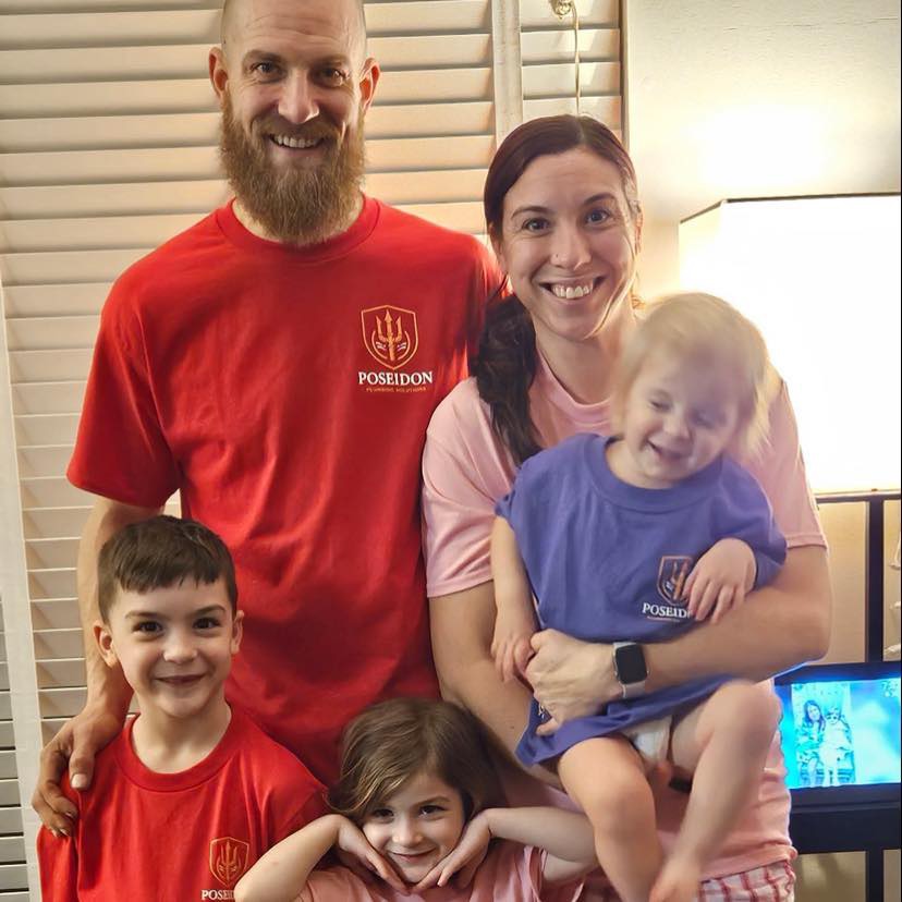 Eric Grange and his family wearing Poseidon Plumbing Solutions shirts